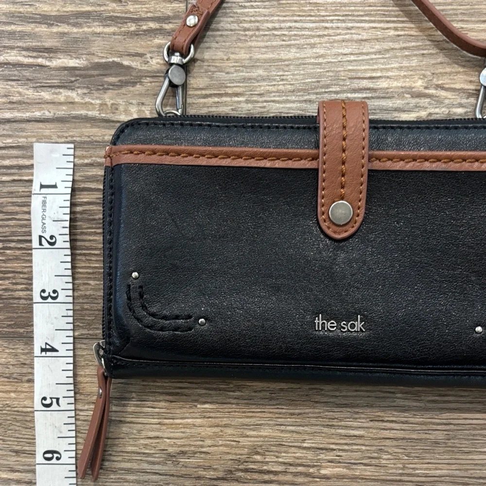 The Sak Large Smartphone Crossbody and Wristlet Leather Wallet Black and Brown